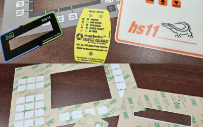 Control panel overlays with selective adhesive